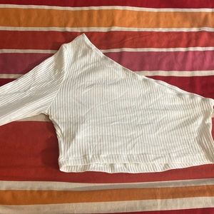 one shoulder cropped longed sleeve shirt.